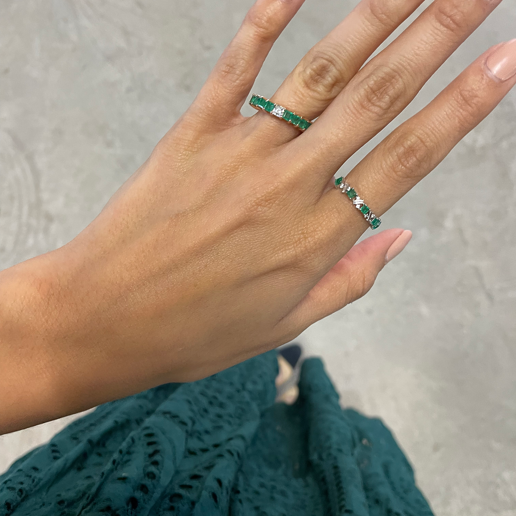 Emerald Eternity Ring With an Odd Diamond