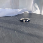 Load image into Gallery viewer, Sapphire Eternity Ring With an Odd Diamond - HIBA JABER
